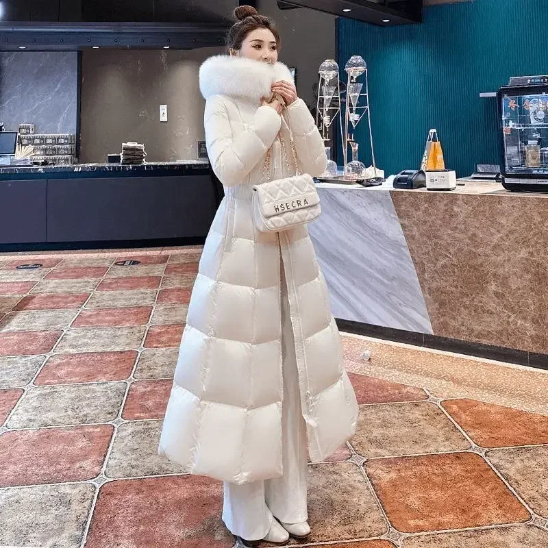 2025 Cappotto lungo da piumino in cotone da donna alla moda invernale nuova da pendolare a vita alta slim fit con cappuccio
