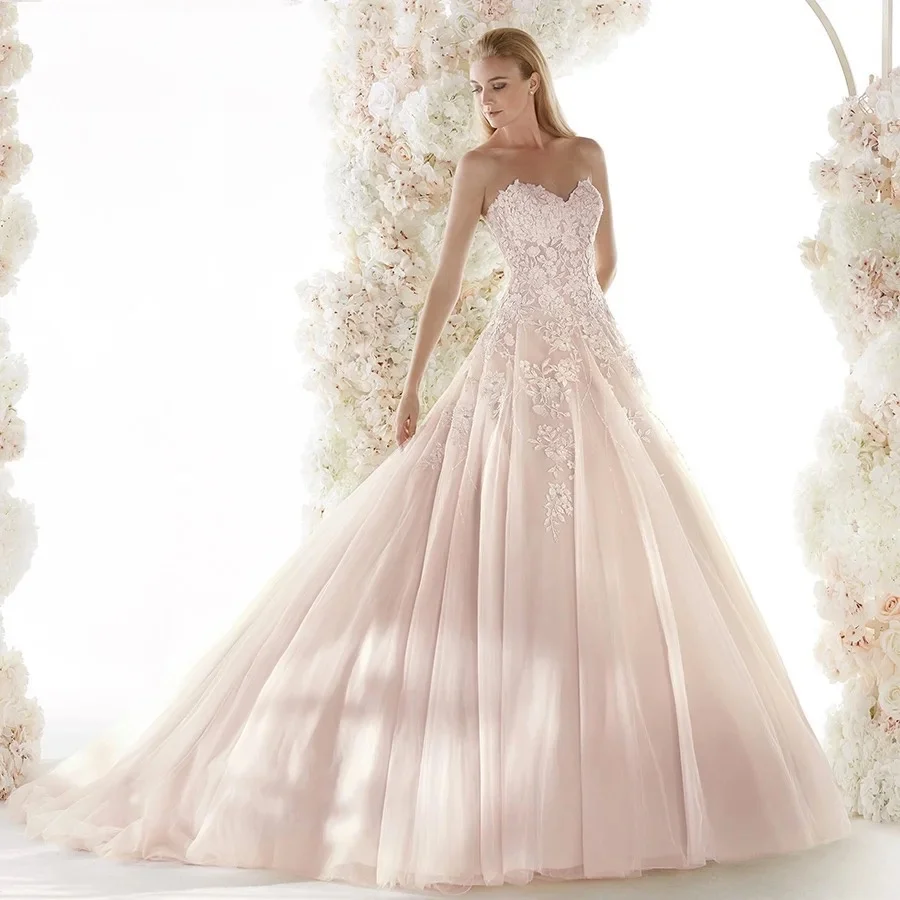 Luksusowe frezowanie różowa suknia ślubna z odkrytymi plecami aplikacje suknia dla panny młodej seksowne suknie ślubne Sweetheart Vestido De Noiva dostosowane