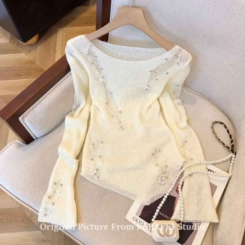 

French gray heavy industry beading hole design sense hollow sweater women's autumn winter irregular sweater pure desire XQ200
