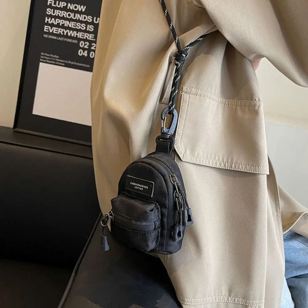 Bolsa crossbody portátil para homens e mulheres, mini porta-moedas, casais, fone de ouvido, chave, bolsas de ombro, hip hop, casual, mais recente