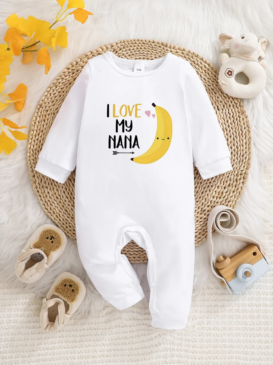 A baby long-sleeved onesie with interesting letter prints. It features a buttoned design for easy putting on and taking off, and