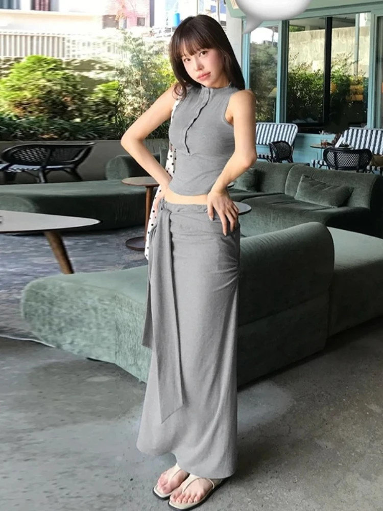 

Женский комплект из двух предметов, корейский комплект Pure Desire, форма тела, подчеркивающий горячий топ без рукавов с полуоткрытым воротником, длинная юбка средней длины