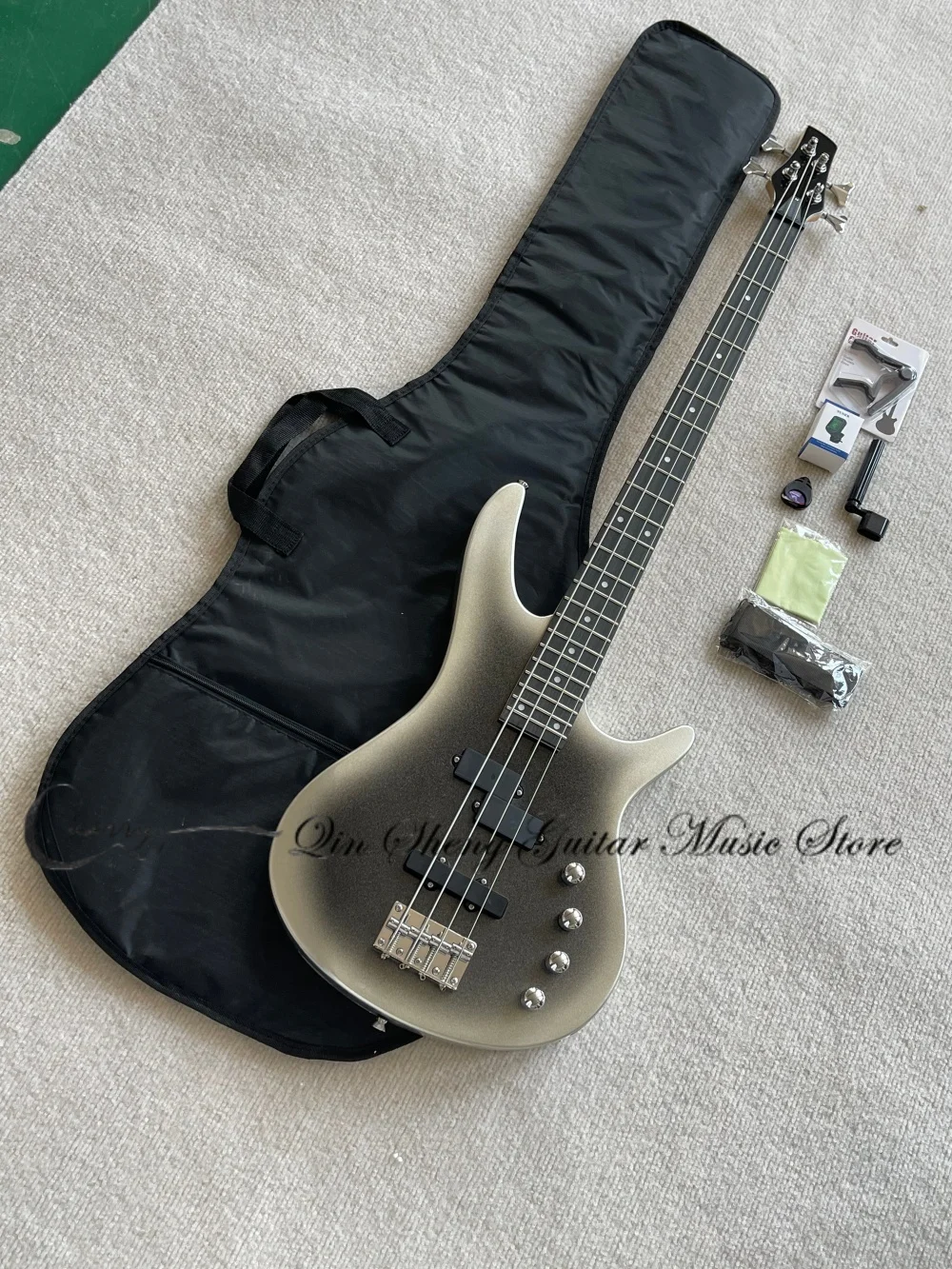 4 strings sliver bass guitar, black solid wood body with maple neck, fixed bridge, included bass bag and tuning clips
