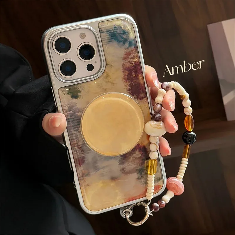

Electroplated droplet adhesive stone brown dyed phone case with round bracket and bead hanging rope for iPhone13 14 15 16 promax