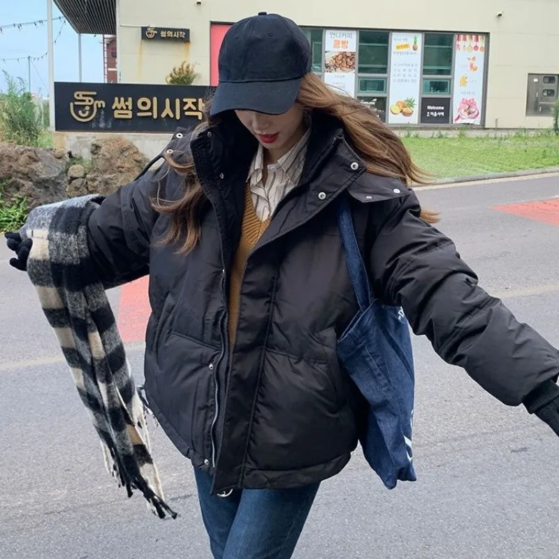 The New Autumn Winter Couple's Cotton-padded Jackets with A Unique Design Sense, Featuring Thick, Loose Bread Coats and Caps.