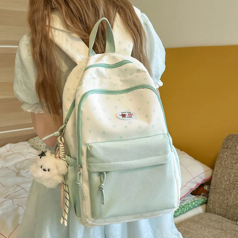 Stylish backpack for girls, featuring a cute star print, large capacity, suitable for middle school students, with a unique and
