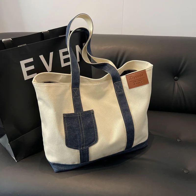 Wear-resistant and durable spliced color-blocking women's handbag, large-capacity tote bag, zipper commuter single-shoulder bag