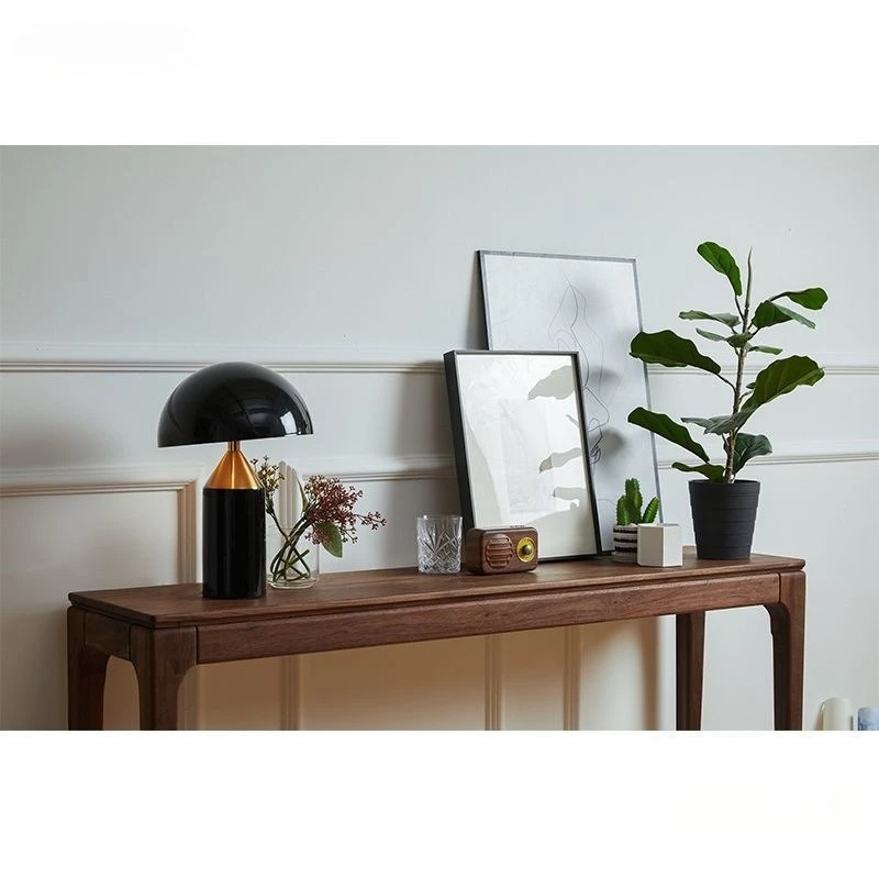 The table entrance table is simple, walnut color, narrow against  wall, and the table enters the home, solid wood