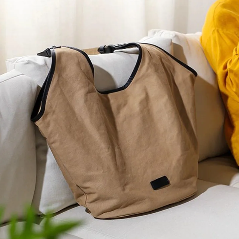 

AETOO This artistic, retro and simple commuting canvas tote bag is a versatile, large-capacity, niche single-shoulder handbag fo