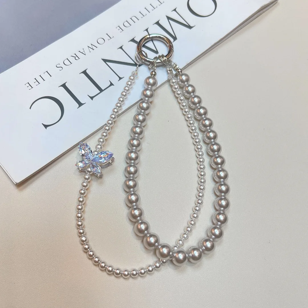 

Жемчужный бабочка и бриллиант, ремешок для мобильного телефона на запястье, небольшой вкус, полный бриллиант, женский высококачественный кулон со стразами, ниша, ручная цепочка