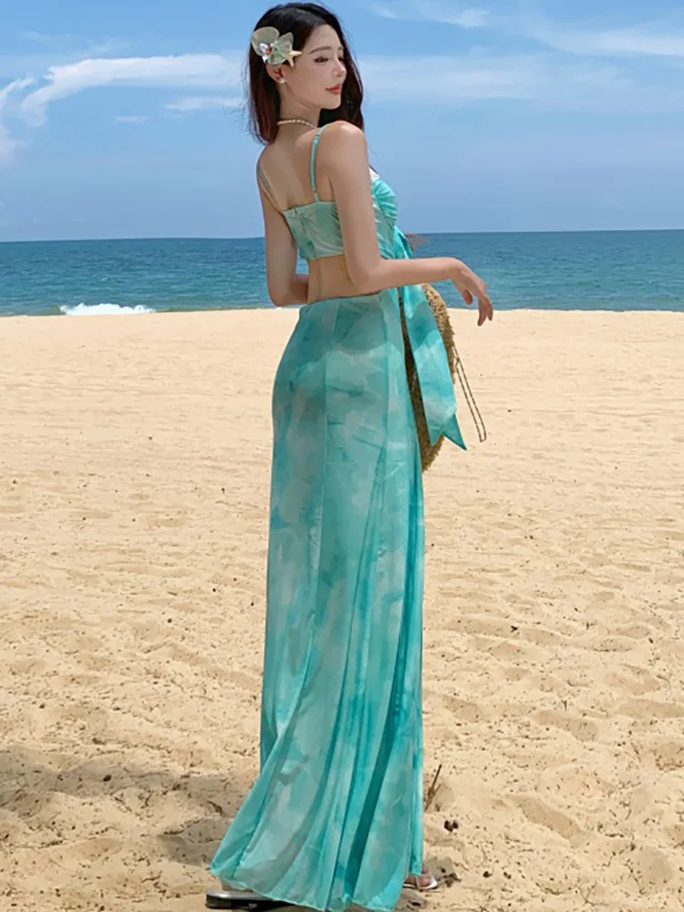 ฤดูร้อนสีเขียวตาข่ายพิมพ์ Hollow OUT ชุดผู้หญิงโบว์ลูกไม้สแควร์เซ็กซี่ชุดสลิง 2025 ใหม่เกาหลีสไตล์ชายหาดชุด