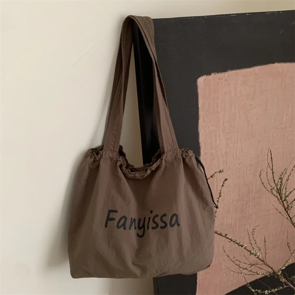 

Simple Korean Drawstring Tote Bags Lightweight Casual Letter Shoulder Bag Designer Large Capacity Shopping Bag Outdoor