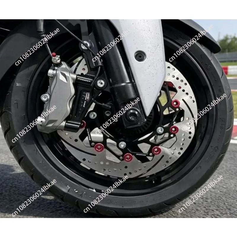 

Motorcycle front brake modification: 300mm floating disc rotor with caliper adapter and dedicated brake pads