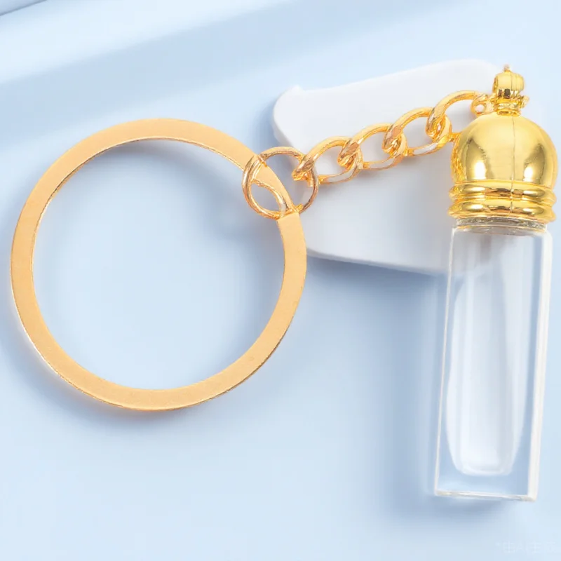 

Portable Glass Bottle Keychain Tiny Refillable Perfume Travel Size Essential Oil Dispenser Compact Pendant for Outdoor Adventure