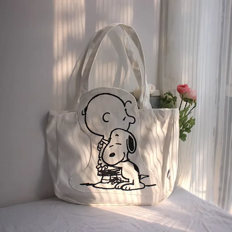 กระเป๋าผ้าใบผู้หญิงความจุสูงกระเป๋าแฟชั่นการ์ตูน Snoopy กระเป๋าถืออเนกประสงค์หนึ่งไหล่ Tote กระเป๋าเดินทางกระเป๋า