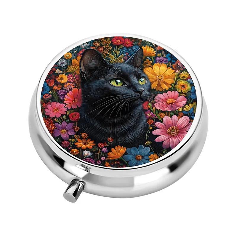 A small pill storage box, designed with a tabby cat pattern, featuring three compartments. This compact medicine storage box is perfect for travel and can easily fit into a wallet or bag.