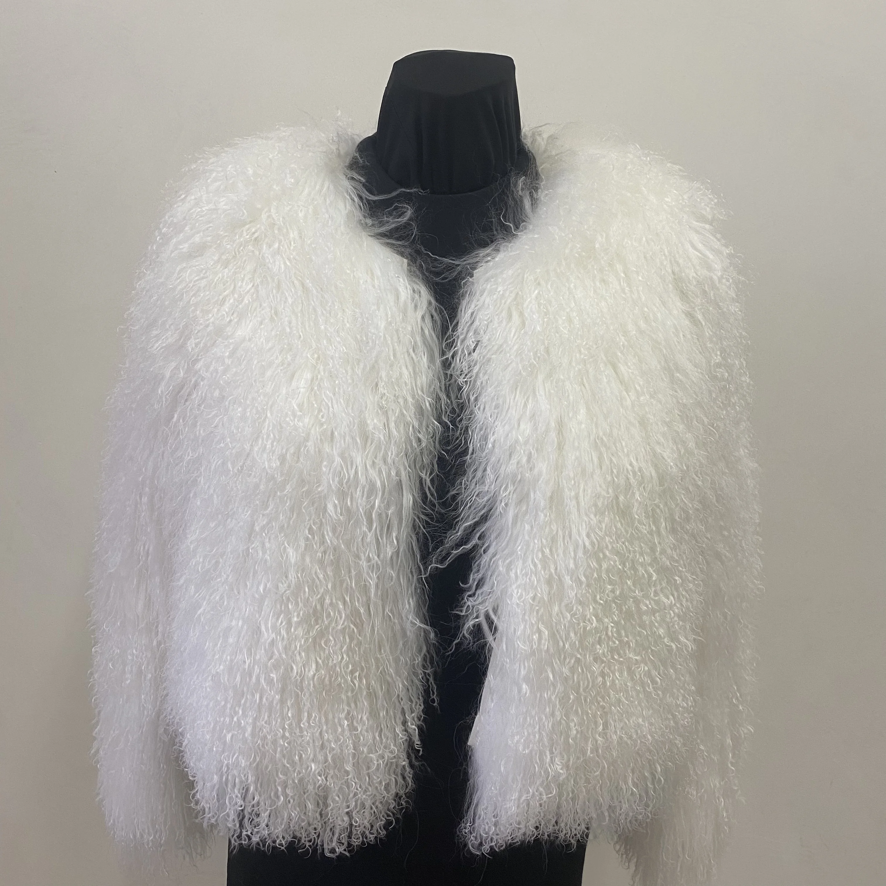 A fashionable and luxurious winter street-wear coat made of natural Mongolian sheepskin, providing warmth and comfort.
