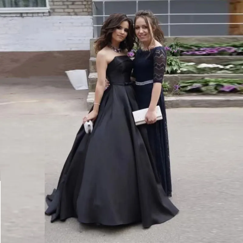 Ballkleider im neuen Stil, schlichtes Satin, trägerlos, A-Linie, schwarze Abendparty-Kleider, Robe De Soirée, bodenlang