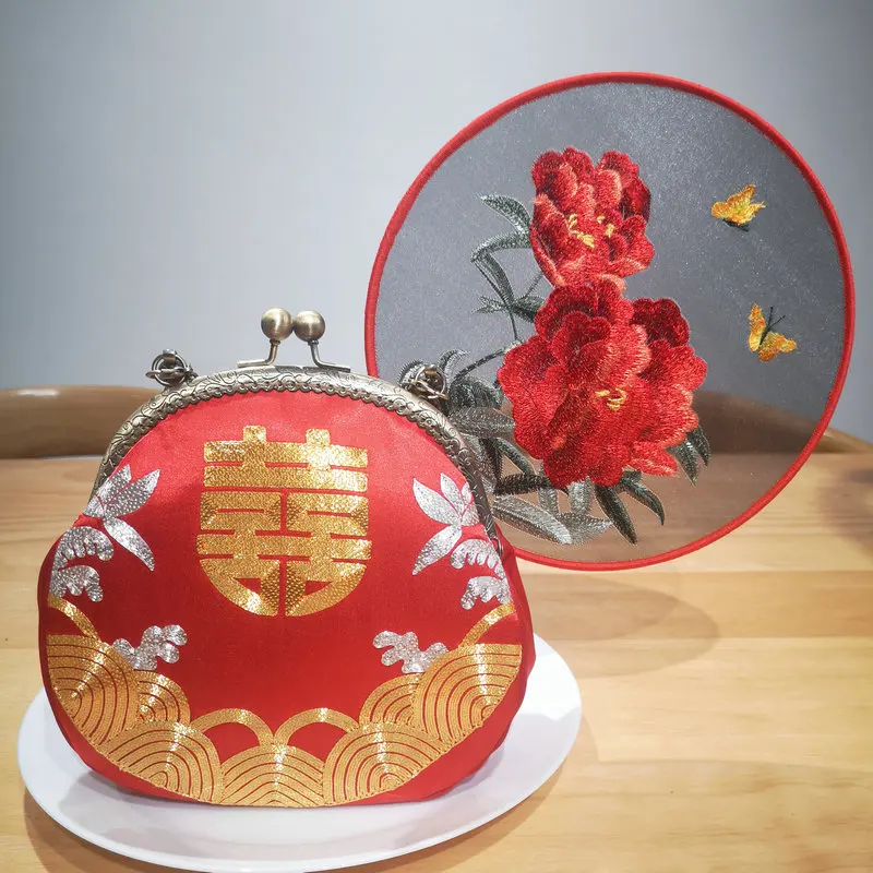 Flowing Blessings Purse – A Red Silk Frame Bag Adorned with Golden Water Waves & Double Happiness Carrying Wishes of Endless