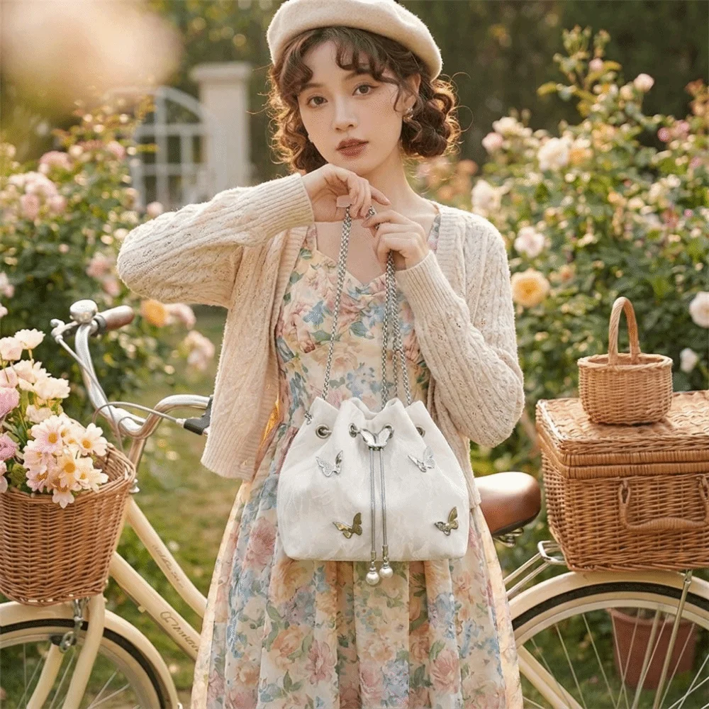 PU Drawstring Bucket Bag Pearl Pendant Metal Butterfly Accent Chain Crossbody Bag Minimalist Design Lightweight Shoulder Bag