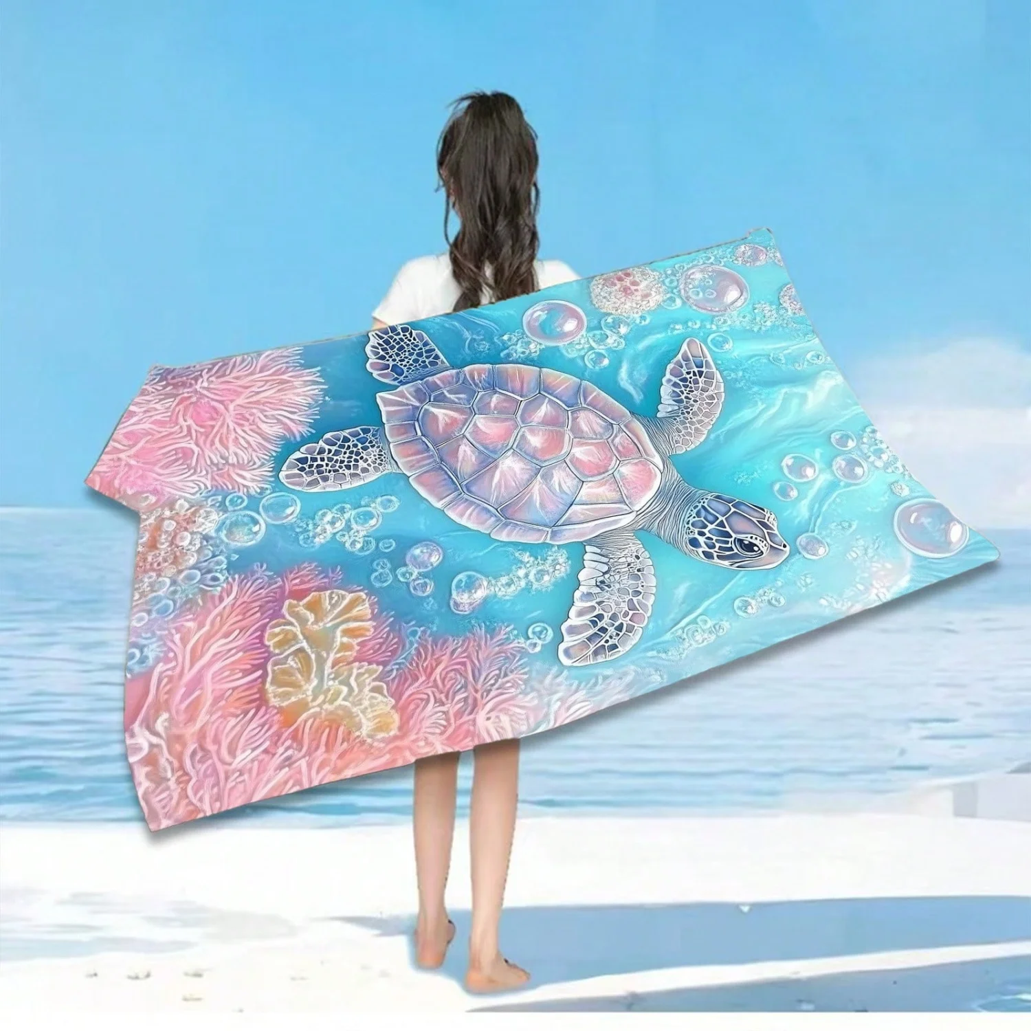 A turtle-patterned beach towel—decorated with vibrant marine life designs, perfect for swimming and outdoor activities.