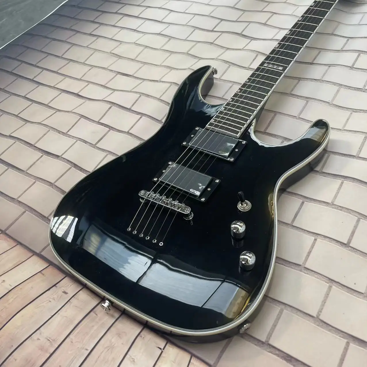 ESP 6-string integrated electric guitar, black body, high gloss, rose wood fingerboard, maple track, EMG pickup, rear string pul