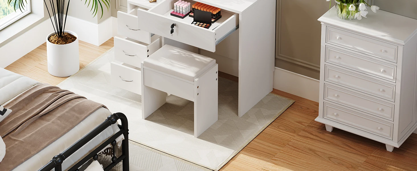 White storage furniture pieces with multiple pull-out drawers, displayed on wood flooring next to potted plant and wall.