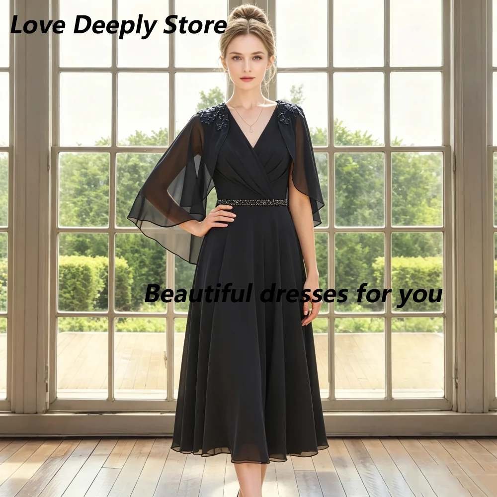 Customized Black Wrap V Neck Mother Of Bride Dresses Chiffon Cape Sleeves Applique Belt A Line Tea Length Wedding Guest Dress