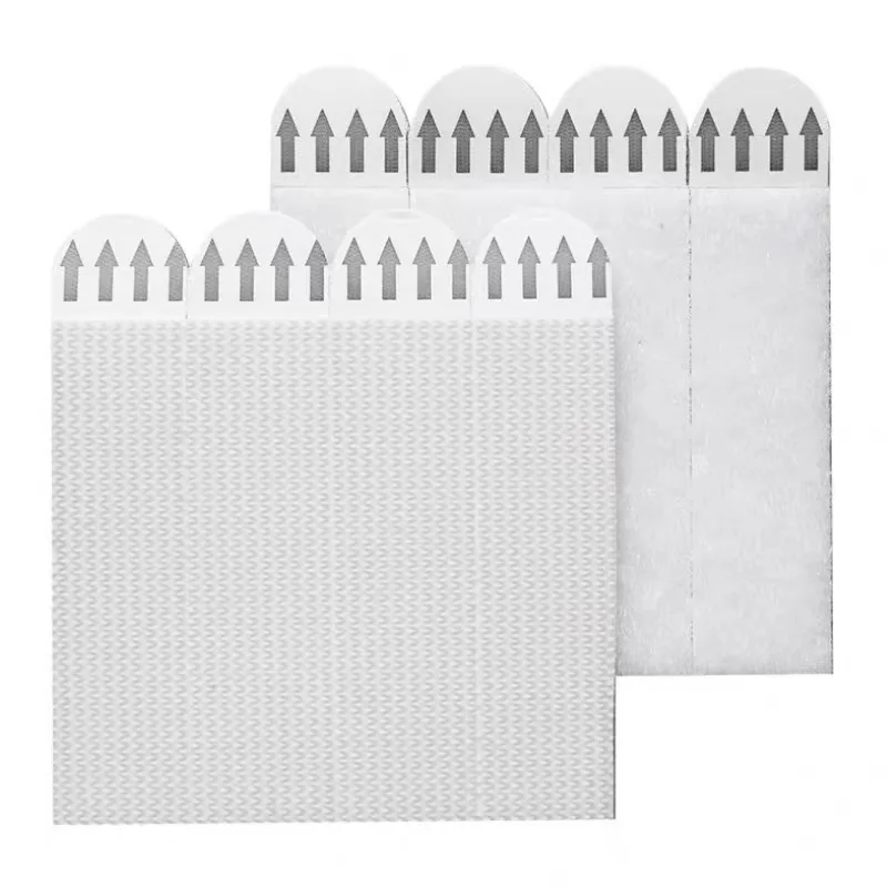No-drill double-sided tape hooks with strong adhesive, suitable for picture frames and wall hanging. These magic tape strips are