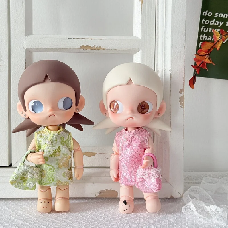 The charming Zsiga figurine is beloved for its unique features. BJD doll, a girl with a collar, wearing a traditional Chinese-st