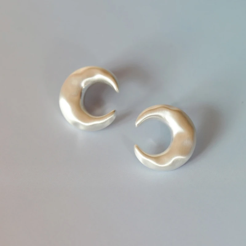 

*Silver crescent drawing earrings