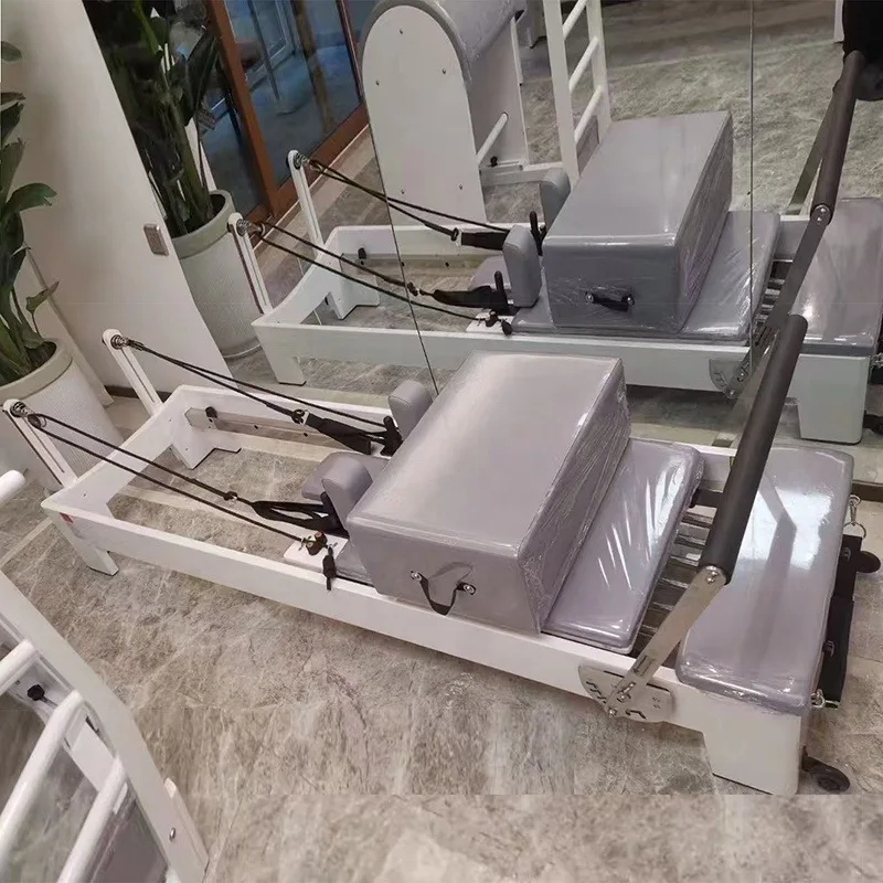 

Customized Pink Leather Sliding Yoga Core Bed Oak Wood Pilates Reformer Machine Include Box and Jump Board