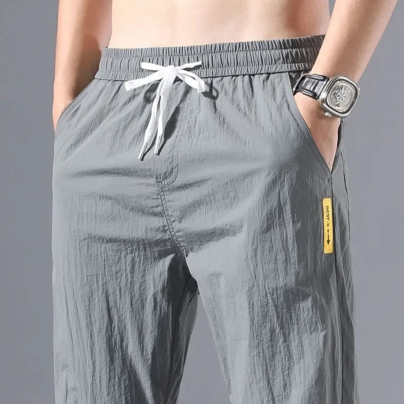 

Ледяной шелк, тонкие спортивные повседневные мужские рабочие брюки, носимые для строительных работ, летние дышащие свободные брюки с низкой талией, девять очков