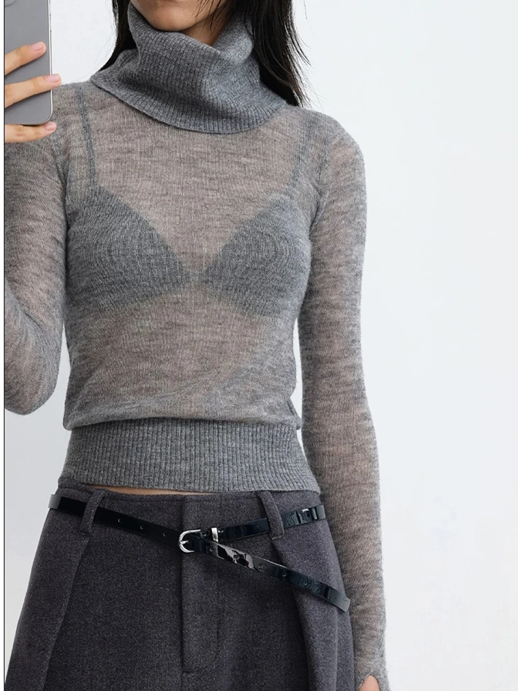 

High-neck knitted sweater made of alpaca wool, with stretch and a slim fit, featuring a slight transparency, suitable for ladies