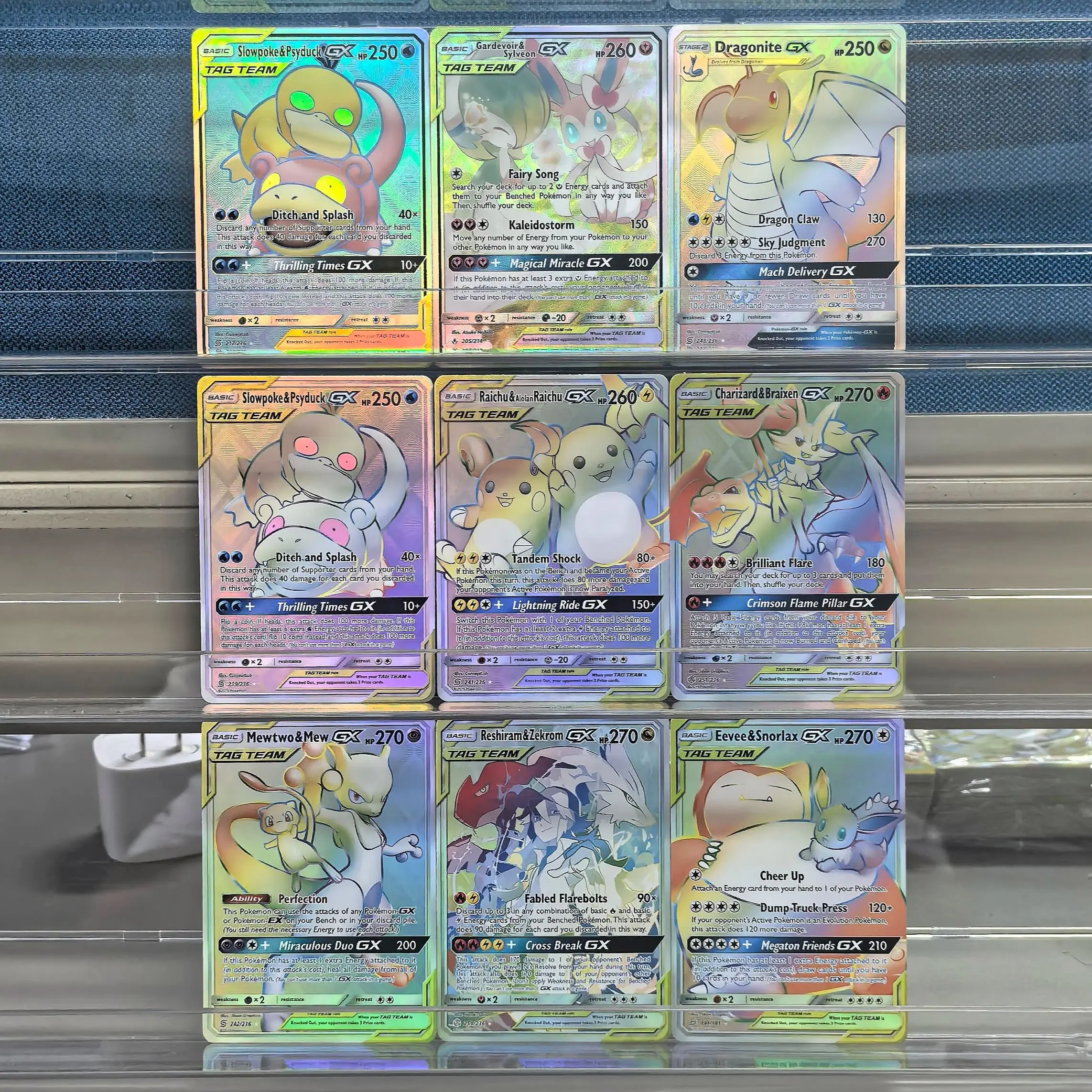 

9 шт., коллекционные карты покемонов на английском языке TAG TEAM Mewtwo Eevee Zekrom Sylveon GX Slowpoke Raichu Charizard, классические игры, аниме-карты