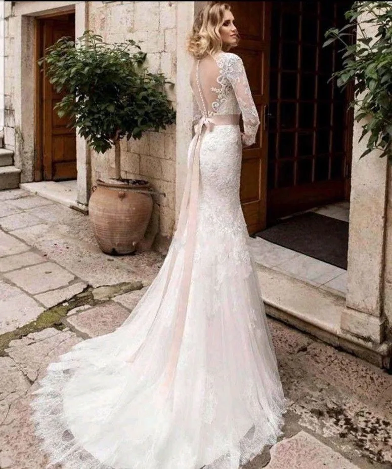 โมเดิร์นลูกไม้ชุดนางเงือกเซ็กซี่ Sheer เปิดกลับ Appliques แขนยาวทรัมเป็ต Gowns แต่งงานสําหรับเจ้าสาวชุดเจ้าสาว