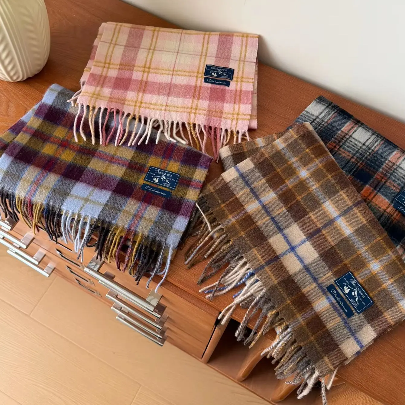 A Contrasting Color Checkered 100% Wool Scarf Paired with a Plaid Pure Wool Scarf for Added Warmth