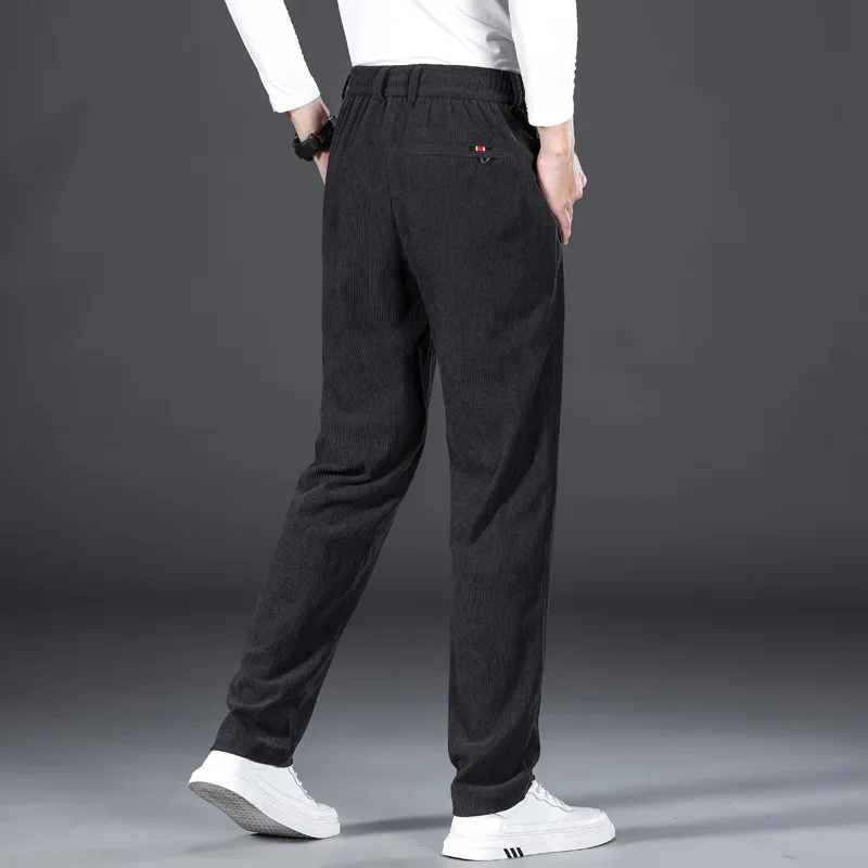 Pantalones informales gruesos de otoño e invierno para hombre con cintura elástica a rayas y pantalones de pierna ancha, pantalones de pierna recta sueltos de pana