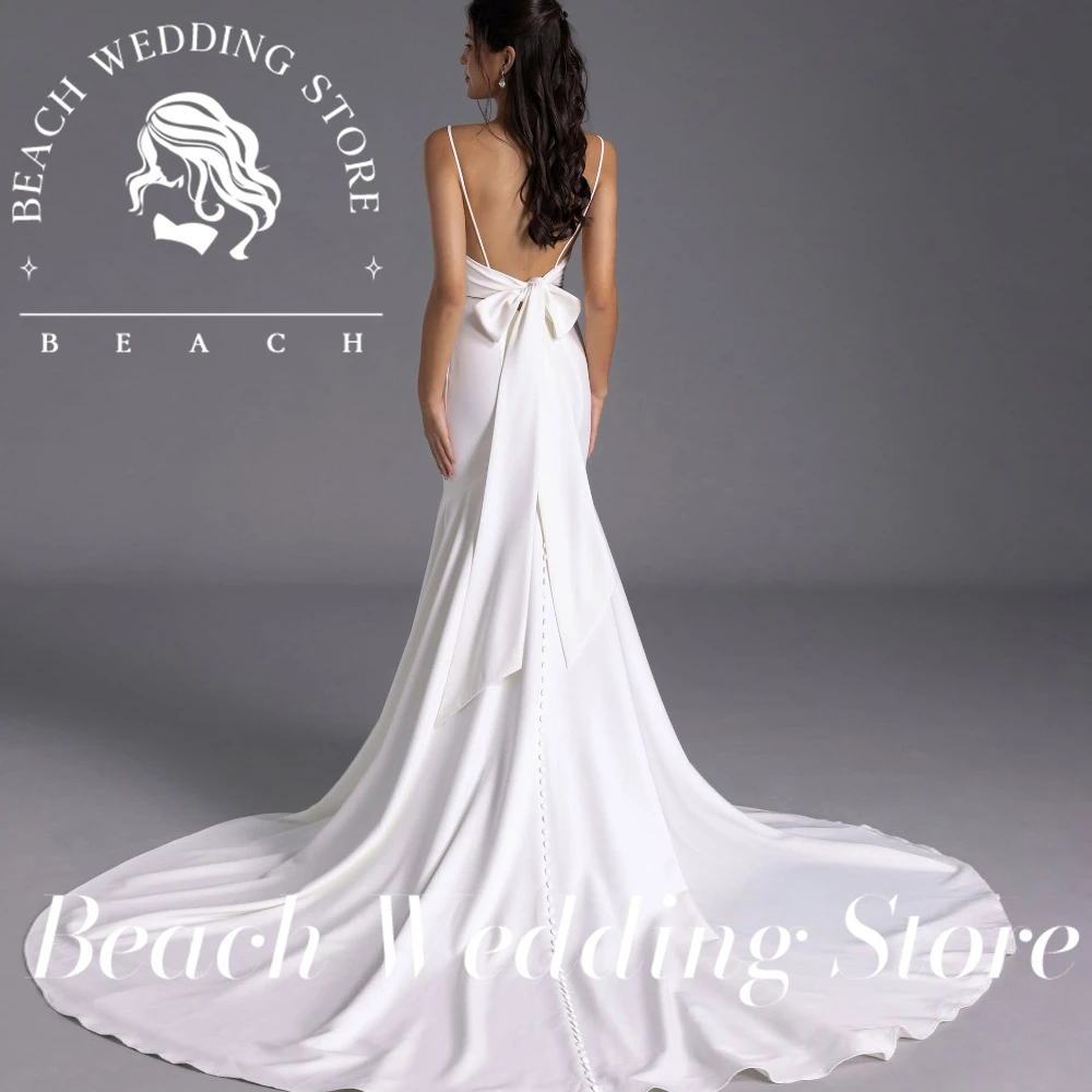 Robe de mariée sirène personnalisée, magasin de mariage sur la plage, bretelles Spaghetti, avec décolleté en V profond, dos ouvert et grand nœud détail