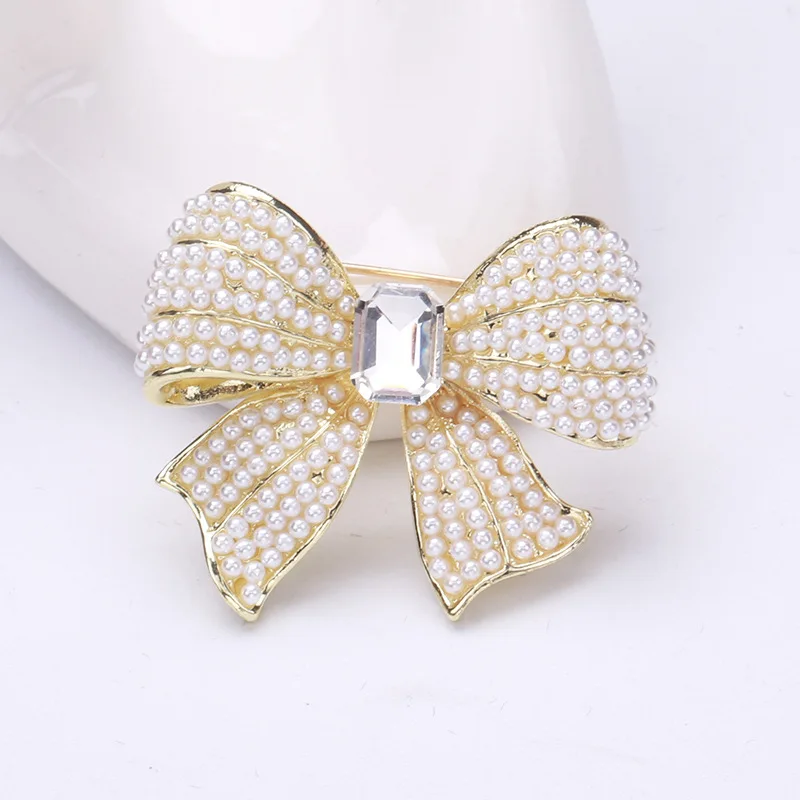 Moda elegante feminino meninas arco strass pérola pinos corsage requintado de alta qualidade feminino festa casamento broches emblemas