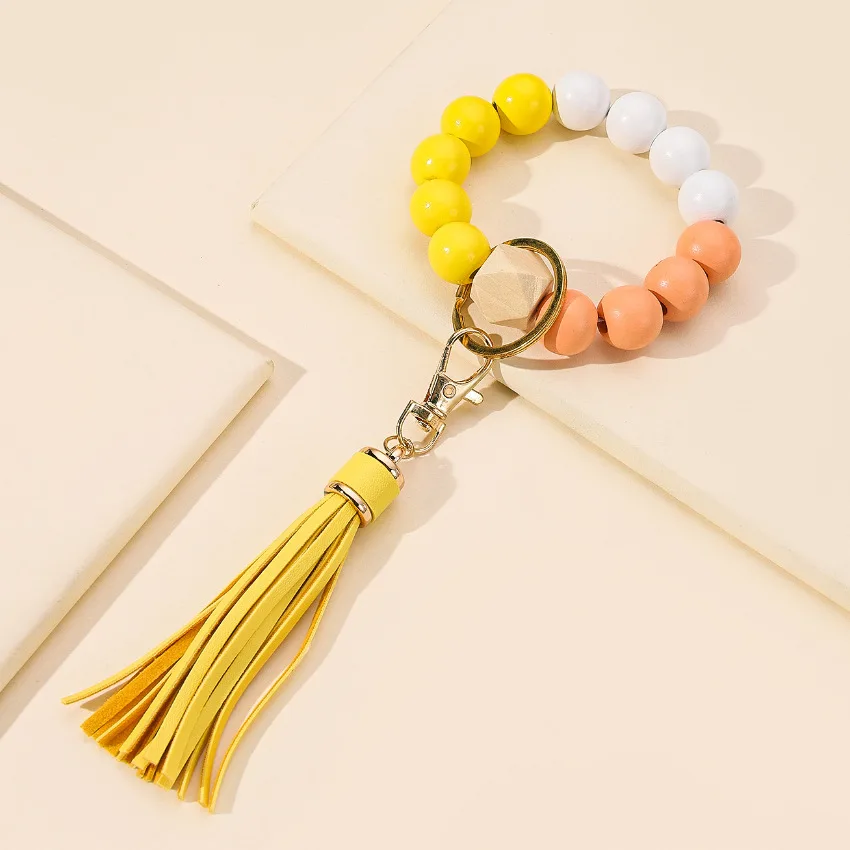 Best Selling Tassels Wood Bead Imitation SiliconeBeads Handstring Keychain Women Men Highly Sought After Bracelet Gift Key Chain