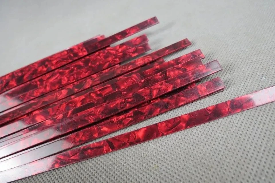 10STRIP RED PEARL CELLULOID BINDING,Measures 7mm x 1.5mm thick and 1600mm long