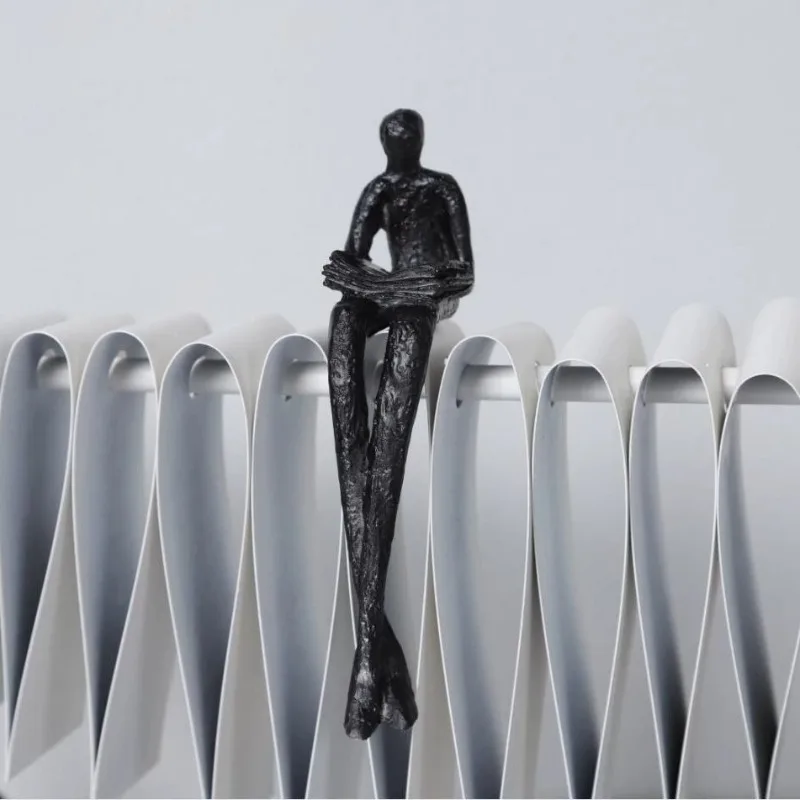 Nordic light luxury metal creative figure modeling artwork decoration, lonely little black entrance TV cabinet ornament