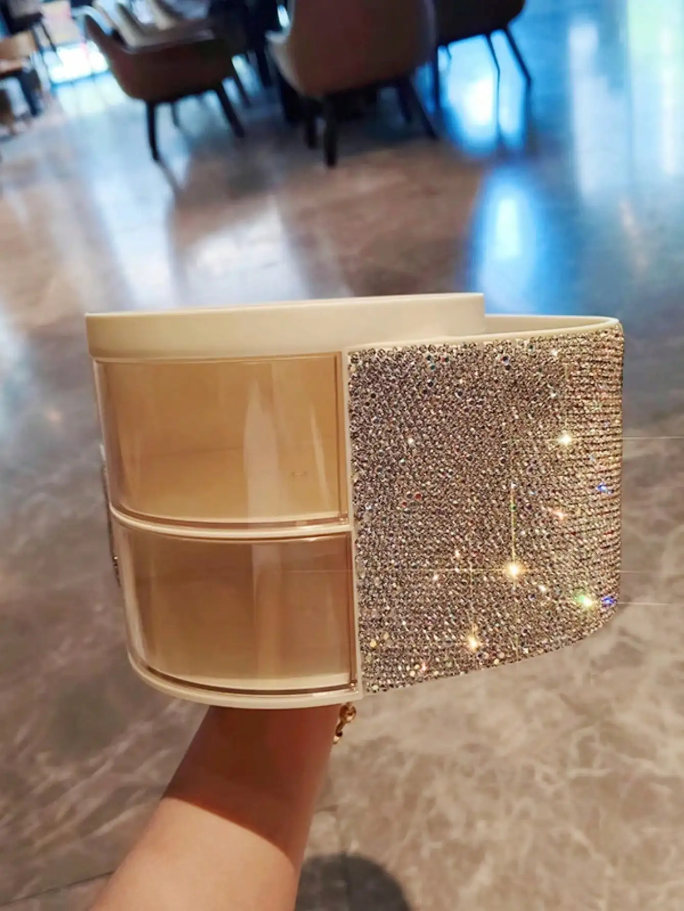 One artificial diamond-encrusted makeup brush and a drawer-style storage box for skin care products