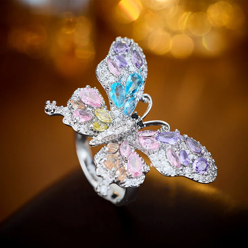 

2025 Micro-inlaid zircon colored gemstone butterfly Design ring with adjustable opening, a light luxury and versatile bracelet
