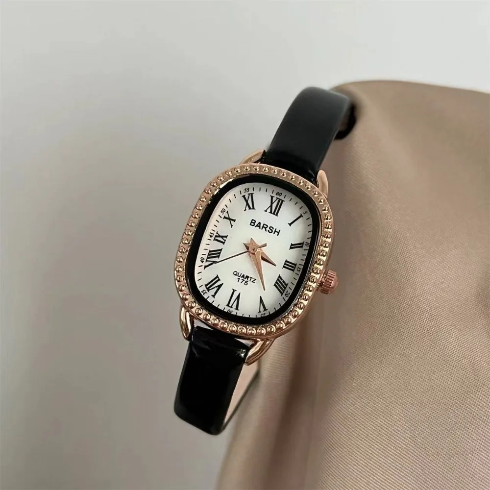 ساعة نسائية بسيطة رفيعة بحزام جلدي موضة بيضاوية بمينا روماني ساعات كوارتز للنساء ساعات يد فاخرة هدية للسيدات