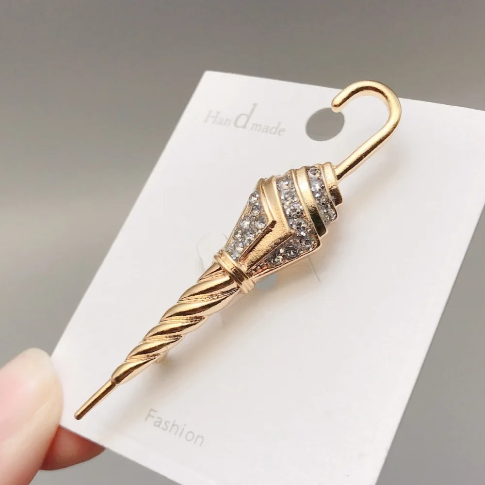 Cross border minimalist metal coat jacket chest flower pin accessory, French retro vintage diamond inlaid umbrella brooch