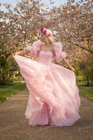 Pink Flowing Gown With Puffy Sleeves And Ruffled Hemline Graceful And Feminine Design Perfect For Formal Occasions Custom Made