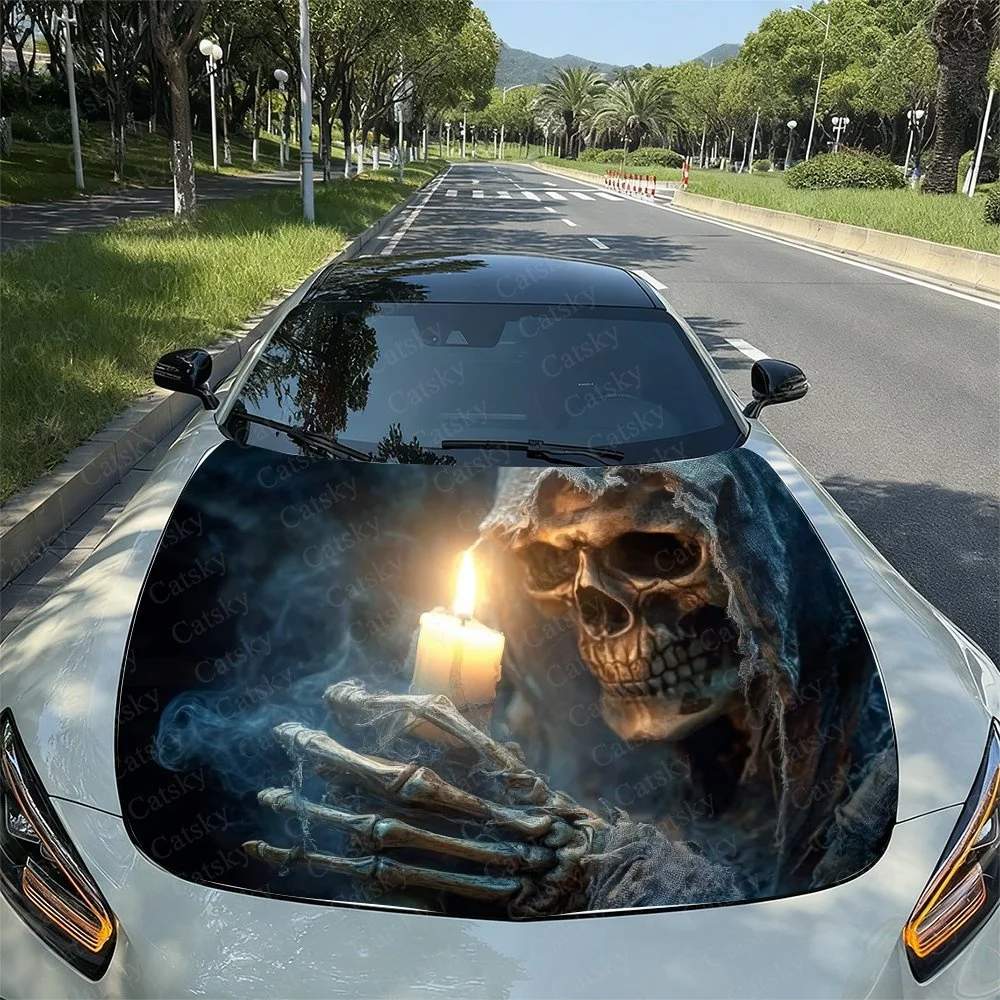 Gothic skull holding candles design on car hood. Dark, eerie aesthetic with smoky background. Perfect for Halloween or spooky en