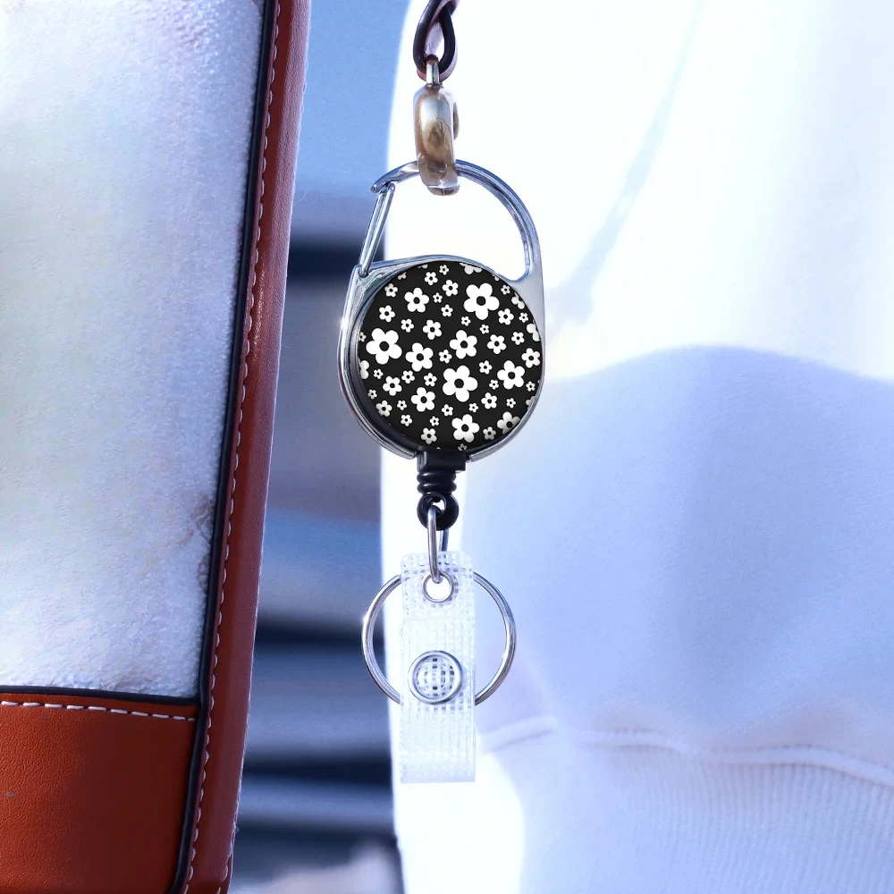 Hot selling circular chrysanthemum pattern Easy disassemble Zinc alloy badge automatic scroll easy pull buckle keychain H1206 A